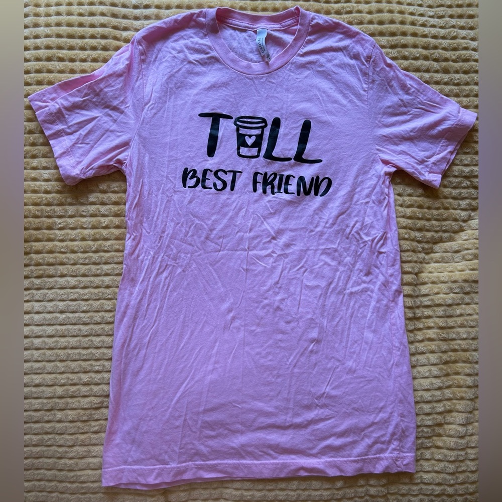 size medium “tall best friend” shirt fits like a large/XL